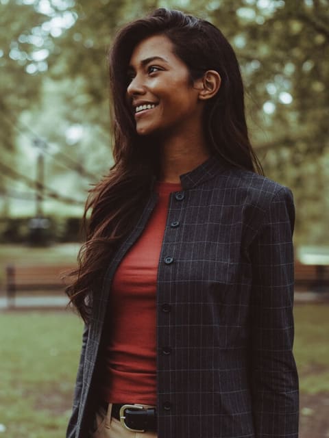 Portrait of Priya, a software engineer at Happydance, in a Liverpool park